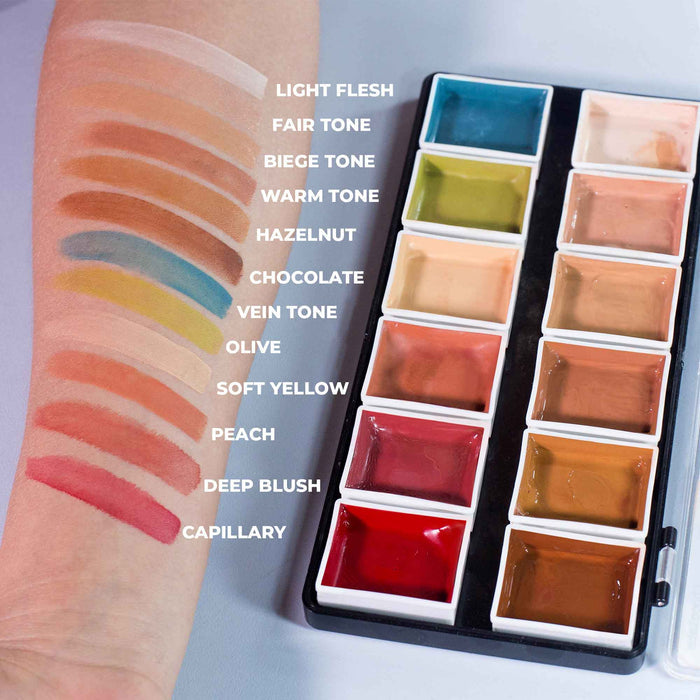Flesh tone swatches on forearm beside open 12-color alcohol-activated palette