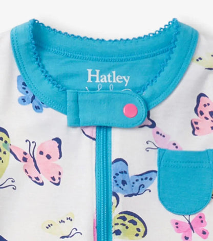Closeup of Hatley butterfly sleeper neckline, aqua trim, snap tab, and chest pocket detail.