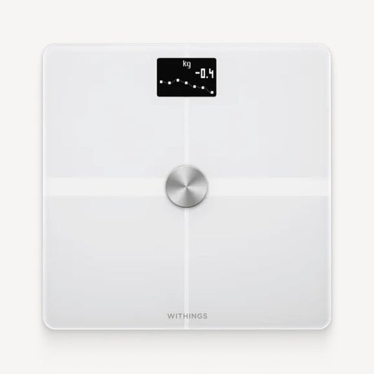 Withings Body+ — White — Top-down view on plain white background, OLED screen showing -0.4 kg weight trend graph — white, minimalist, top view, center dial