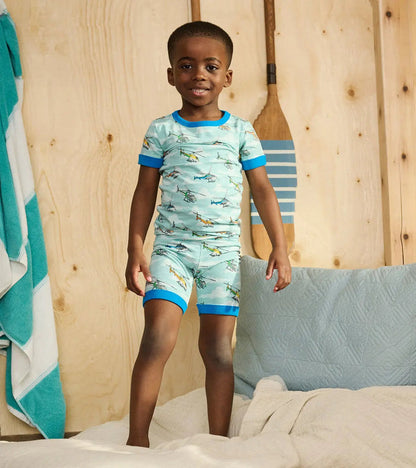 Boy wearing Hatley helicopter short pajamas with soft organic cotton stretch fabric.