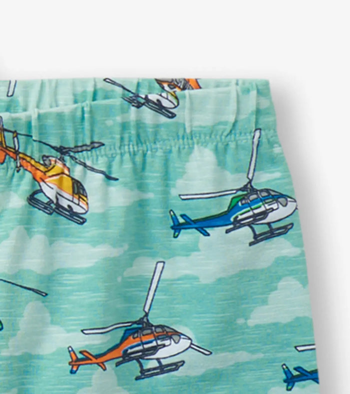 Closeup of Hatley boys helicopter pajama shorts showing aqua print and blue trim.