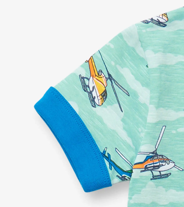 Closeup of Hatley boys cotton pajama sleeve showing helicopter print and blue cuff detail.