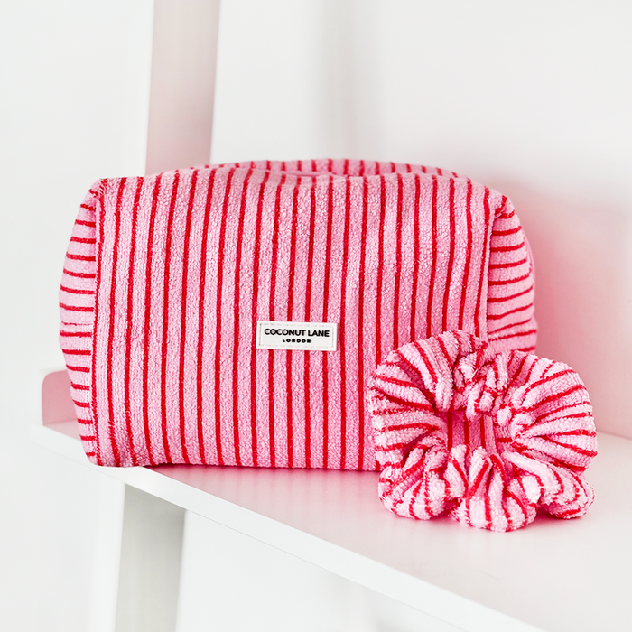 Cherry Stripes towel makeup bag and matching scrunchie set with red stripes on a white shelf.