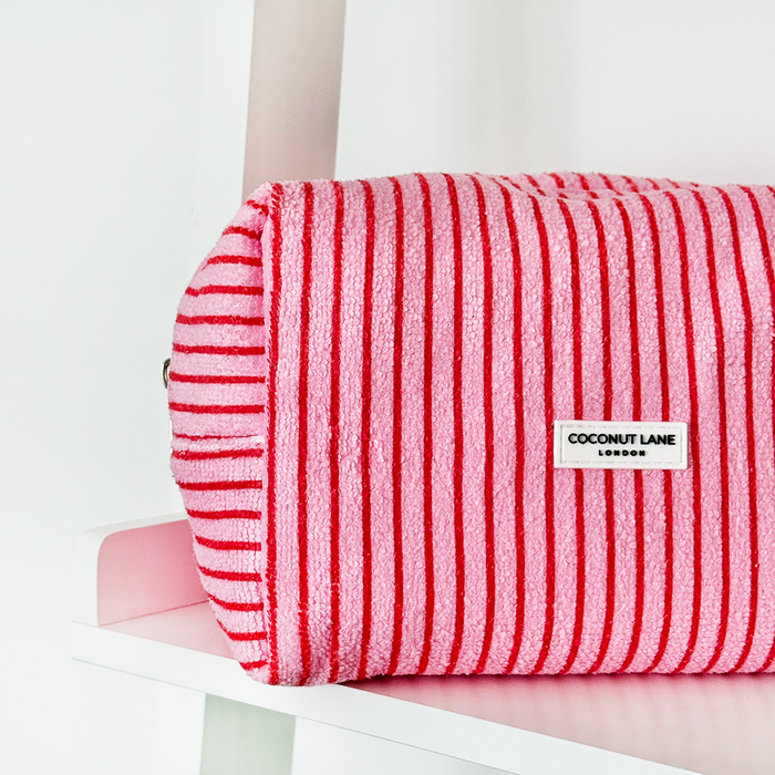 Cherry Stripes makeup bag and scrunchie set with red and white stripe pattern on a white shelf.