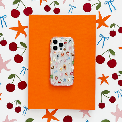 Clear phone case with orange background, decorated with cherries and starfish in a vibrant ocean-inspired pattern.