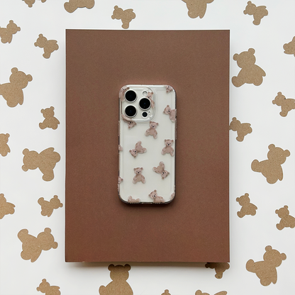 Clear phone case with teddy bear pattern by Coconut Lane on a brown folder, teddy bear motif in the background.