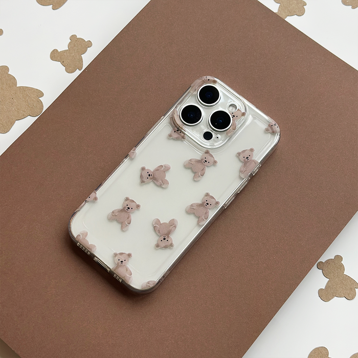 Clear phone case with teddy bear print by Coconut Lane displayed on a matching teddy bear patterned surface.