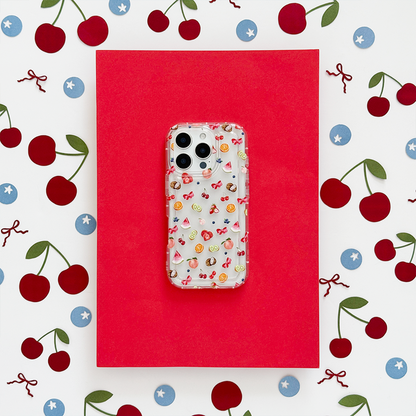 Clear phone case with colorful cherry and star pattern on a red background.