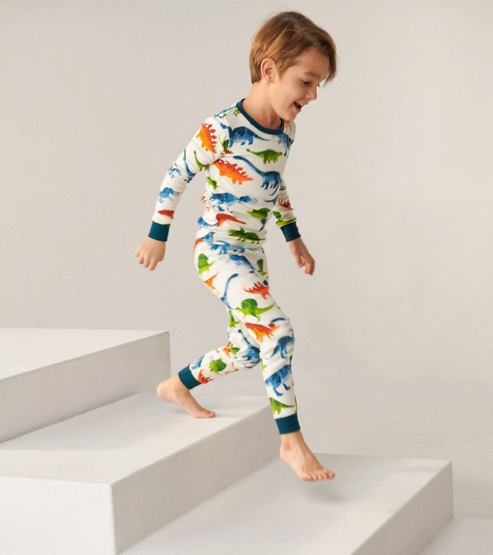 Boy wearing Hatley Dinosaur Park pajamas with soft organic cotton and snug-fitting comfort.