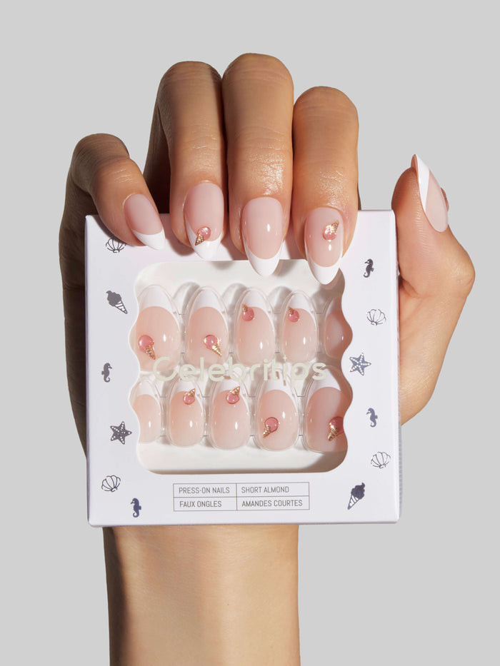 Hand holding a box of Gelato Gelato press-on nails with a neutral background