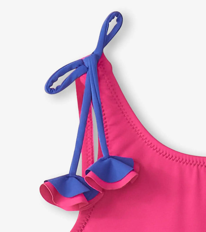 Close-up of Hatley rainbow unicorn swimsuit shoulder bow detail