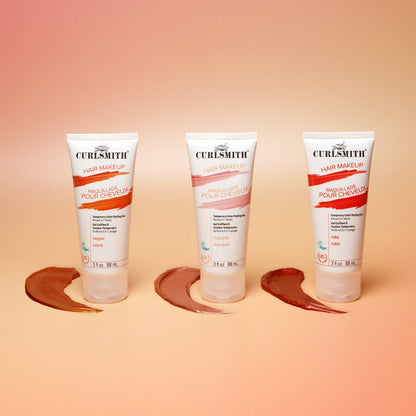 Three bottles of Curlsmith hair makeup on a peach background