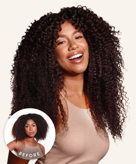 A smiling woman with long, voluminous, defined curls in Natural Black wears a sleeveless beige top. Inset: her previous shorter, less defined curls.