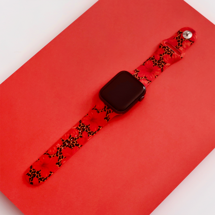Apple Watch strap in red silicone with leopard and hibiscus floral print.