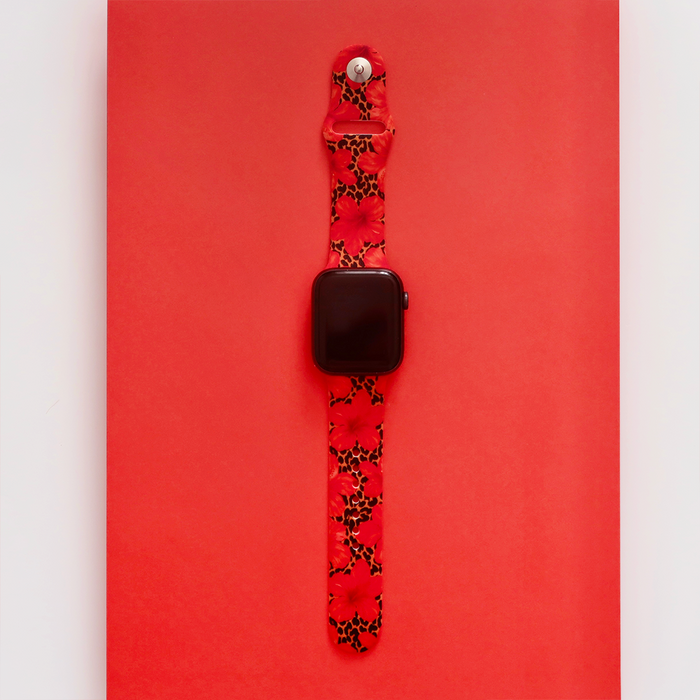Apple Watch strap in red silicone with leopard and hibiscus floral print.