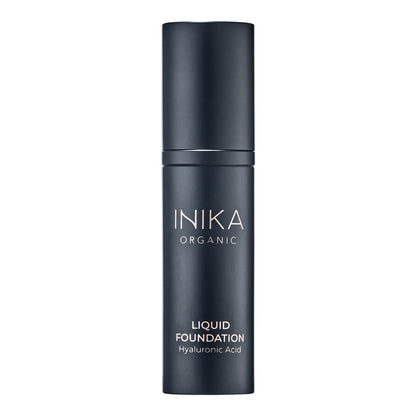Black bottle of INIKA Organic Liquid Foundation on a white background.