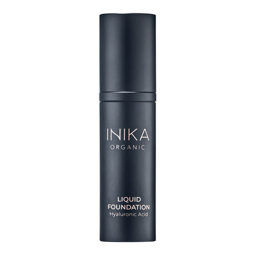 Black bottle of INIKA Organic Liquid Foundation on a white background.