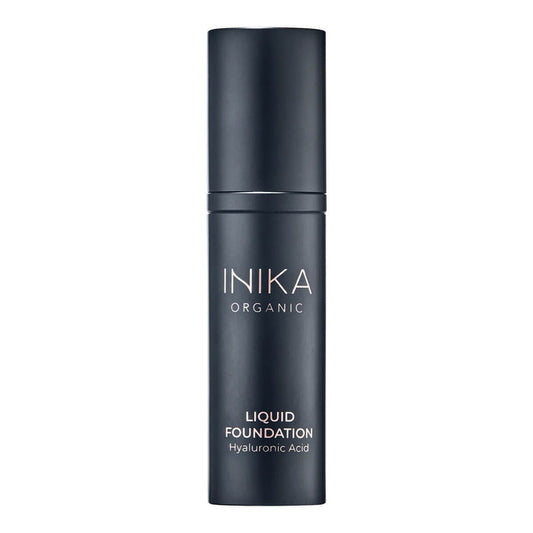 Black bottle of INIKA Organic Liquid Foundation on a white background.