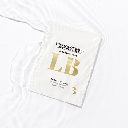 White saschet with gold text and branding on a white background