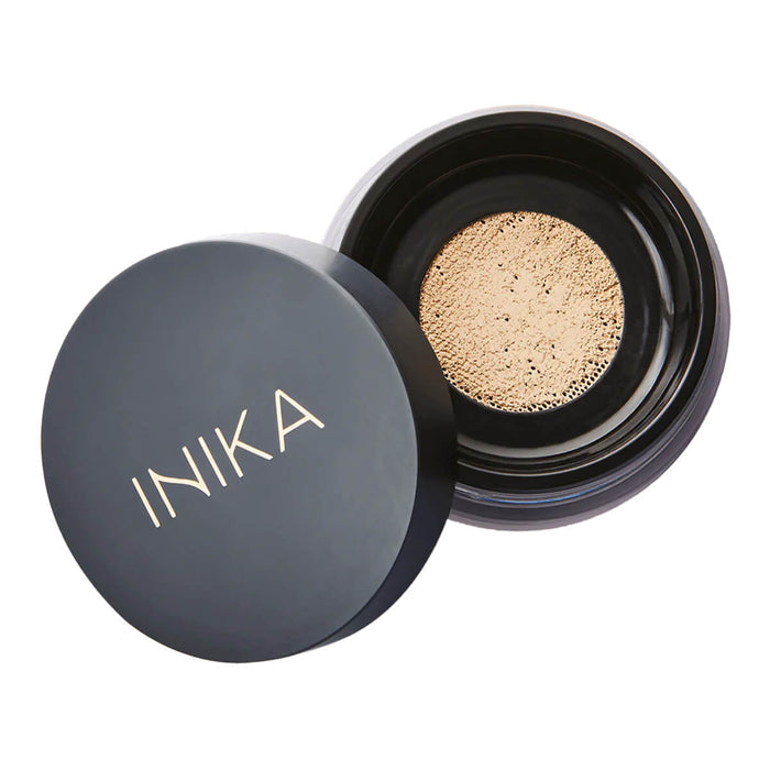 Loose Mineral Foundation in shade Strength container with black lid on a white background.
