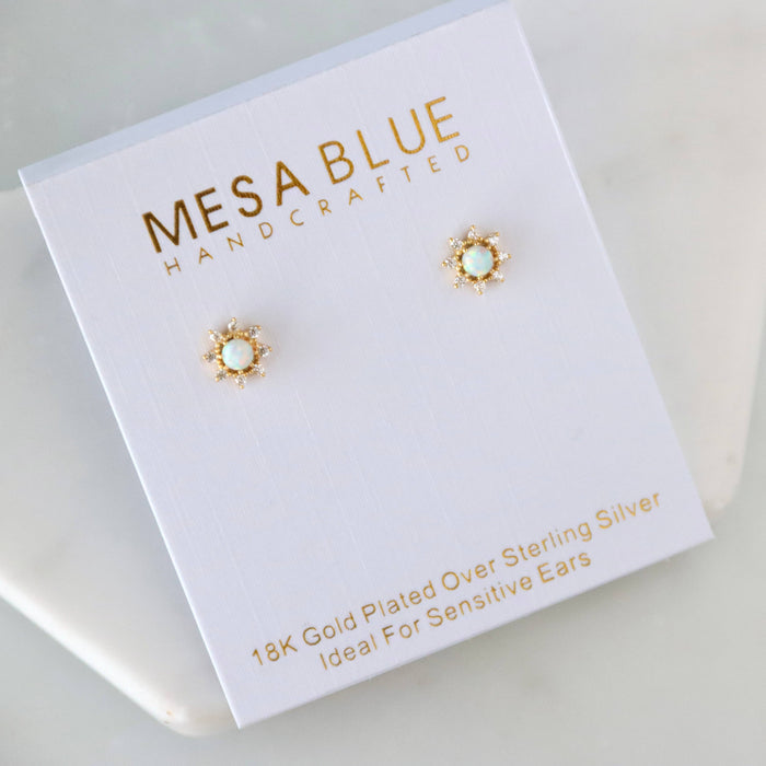 Mesa Blue handcrafted earrings on a white card with gold text