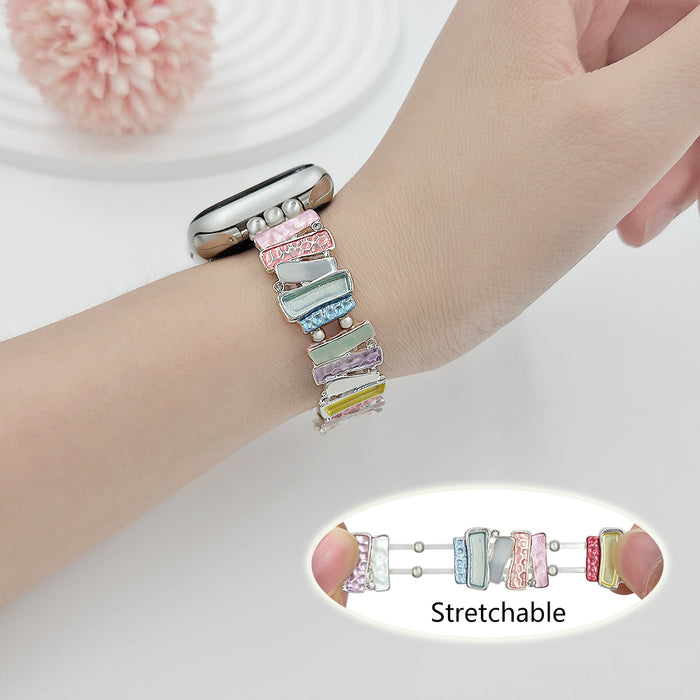 Pastel Mosaic Stretchy Steel Bracelet Band For Apple Watch — Featuring an array of softly-hued enamel tiles in a chic mosaic pattern, this band is designed to turn heads while offering a comfortabl...