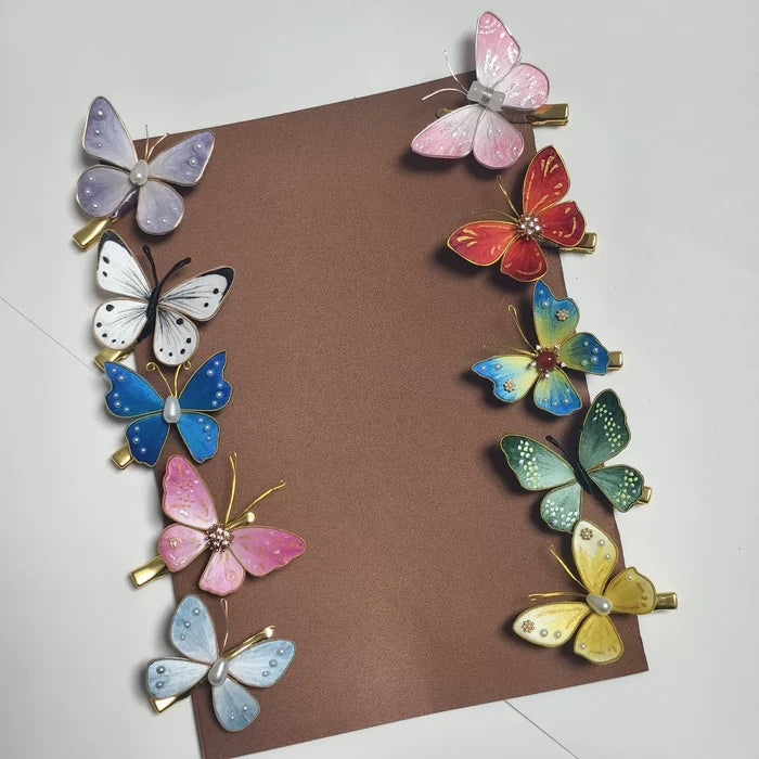 Ten styles of handcrafted Ronghua silk velvet butterfly hair clips in various colors including blue, pink, red, green, and yellow, arranged on a brown card.