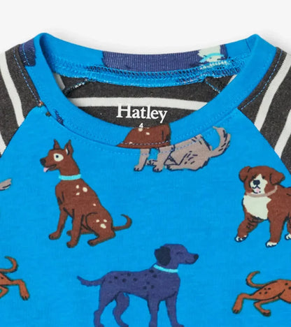Closeup of Hatley boys puppy pajama top showing blue body, striped raglan sleeves, and organic cotton fabric.
