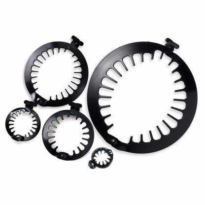 Set of black metal rings with white interior patterns on a white background
