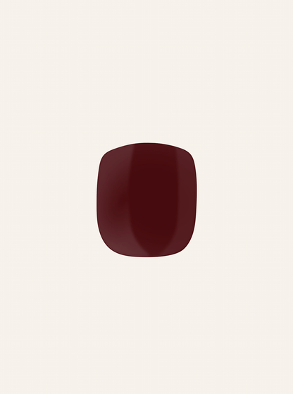 A single red-colored gel nail sticker against a white background, representing a pedicure product.