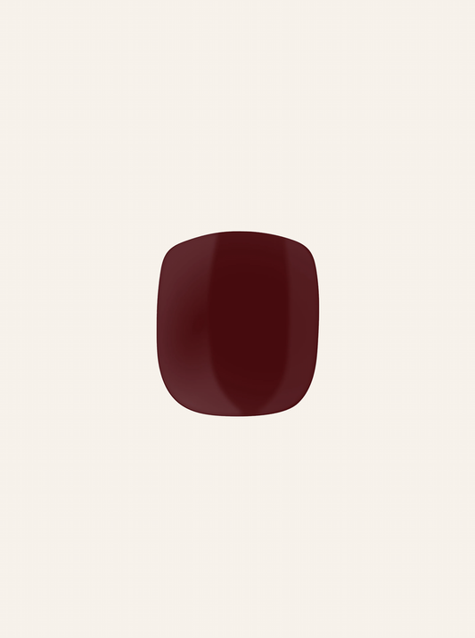 A single red-colored gel nail sticker against a white background, representing a pedicure product.