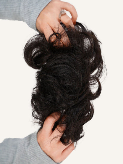 Two hands hold a Perfect Locks Scrunchie Hair Extension in Warm Brown Highlights (6/613) against a plain white background.#color_natural-black-(1B)