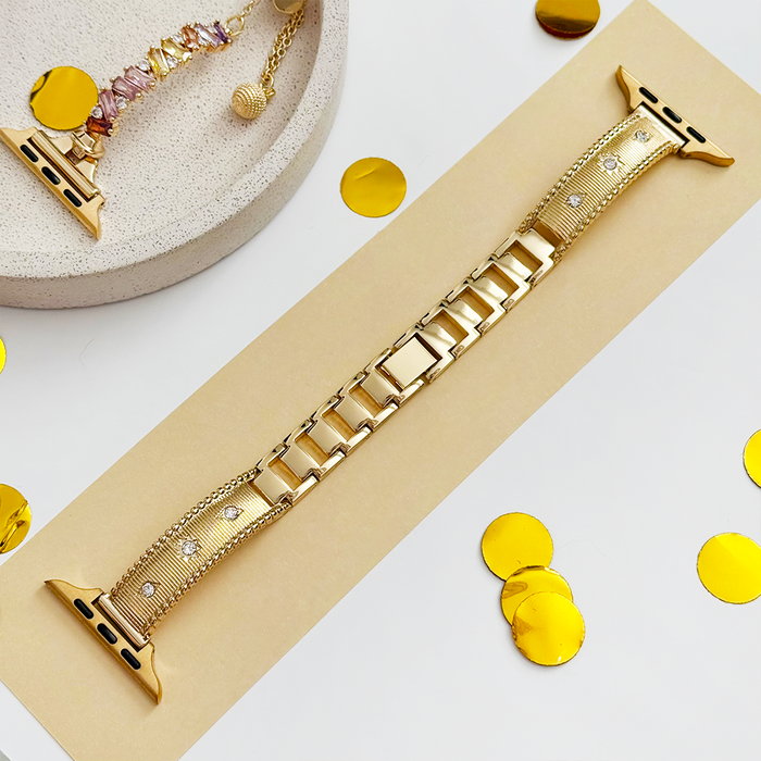 Gold Shimmer Star Apple Watch strap by Coconut Lane on beige surface with scattered gold confetti.