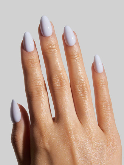 Hand with sky blue press-on nail on a neutral background