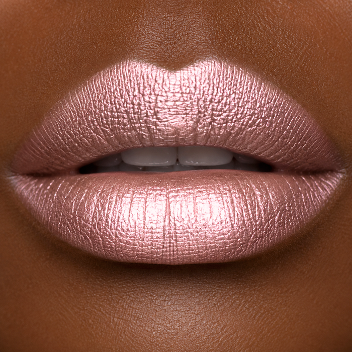 Close-up of a person's lips with a metallic pink lipstick by Runway Rogue in the shade 'Soft Box'