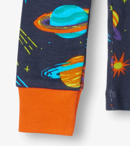 Closeup of Hatley boys pajama cuff with orange trim and Space Explorer print.