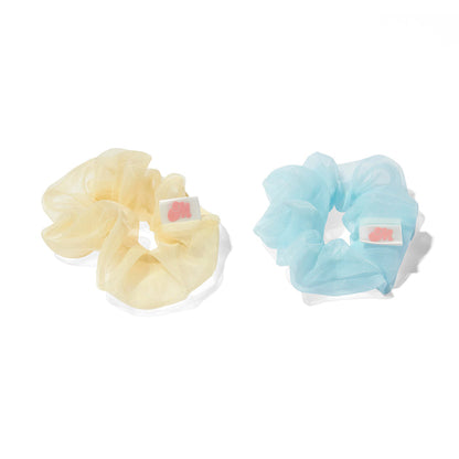Blue and yellow Sugar Cloud Scrunchies Mini on a white background