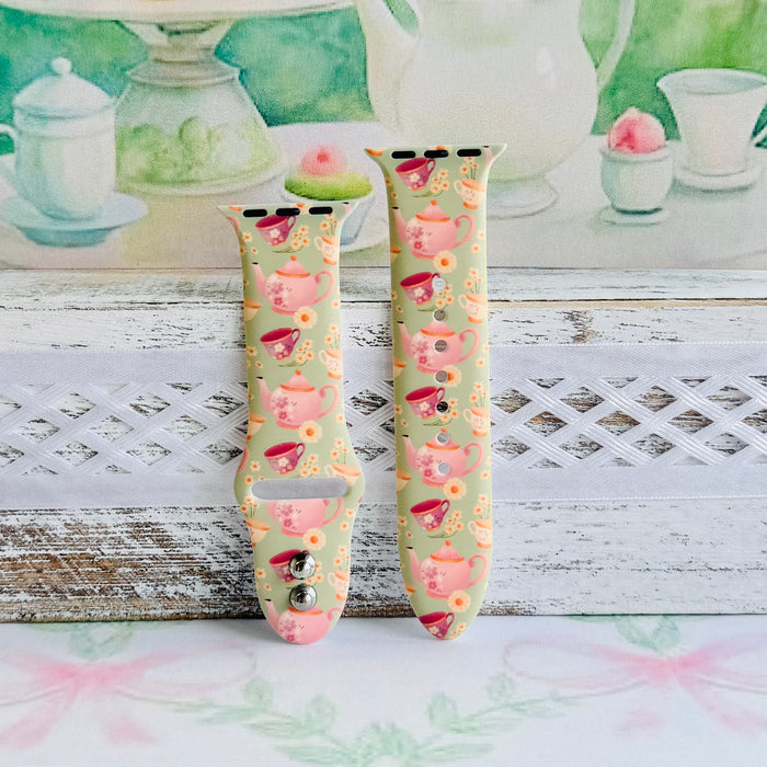 Tea Time Delight Apple Watch band with pink teapots and teacups on yellow-green background with watercolor tea party backdrop