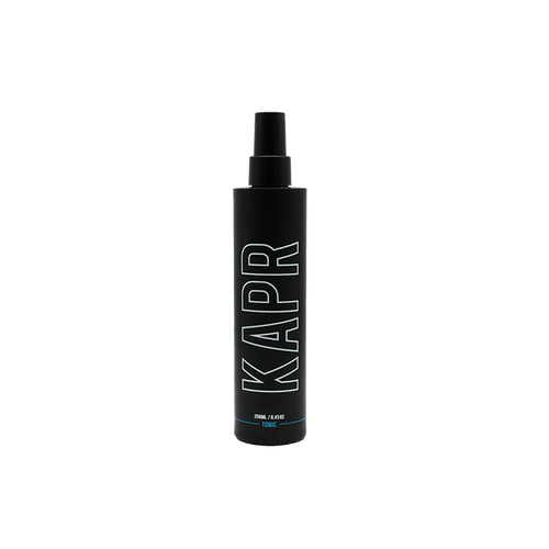 KAPR Tonic – zwarte fles met wit logo op transparante achtergrond, verfrissende haarlotion.
