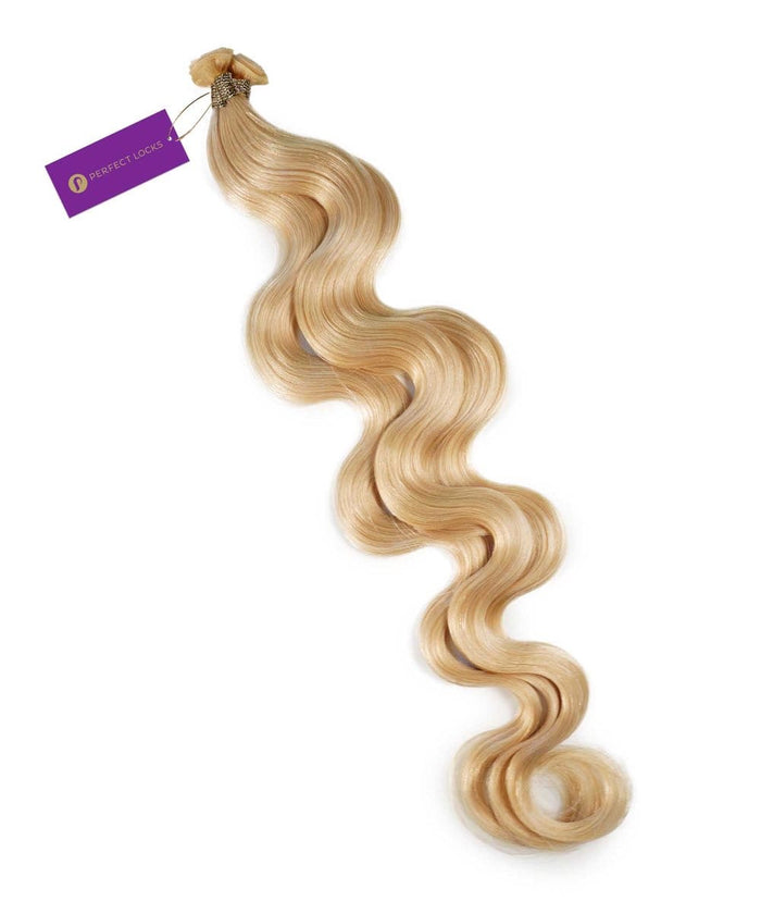 A long, wavy Chocolate Brown  Hybrid Weft Hair Extension with a smooth texture, laid flat, bundled at the top, secured by a purple Perfect Locks tag.#color_platinum-blonde-(613)
